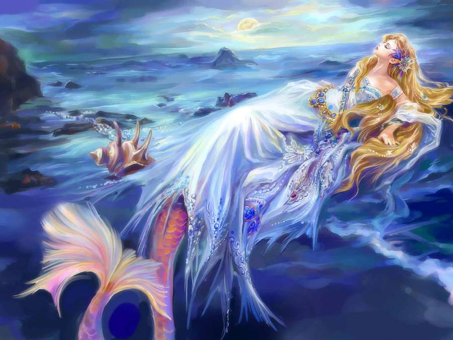 A beautiful mermaid with long golden hair rests on a moonlit beach beside the ocean. — Mermaids Wallpaper