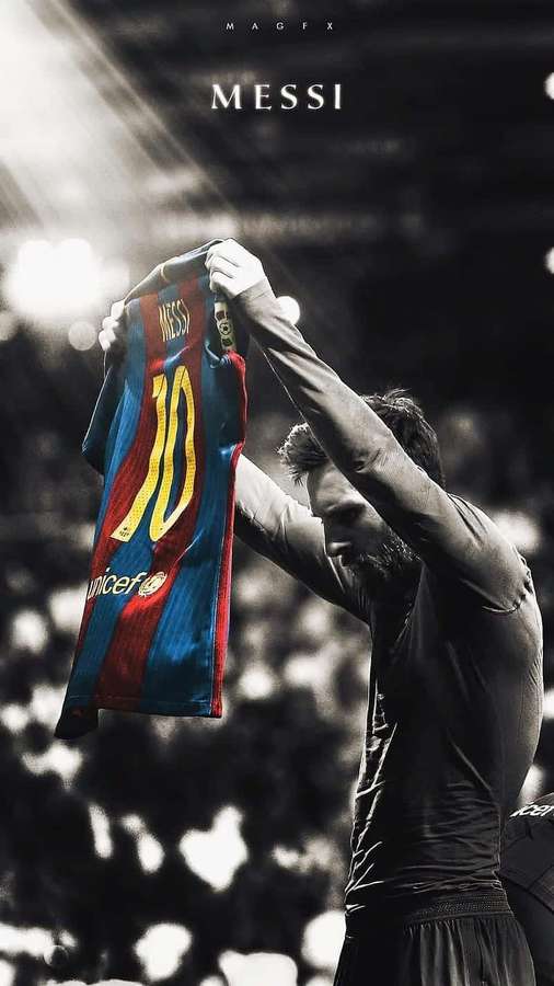Soccer player holding up his number 10 jersey in a stadium celebration. — Messi Cool Wallpaper