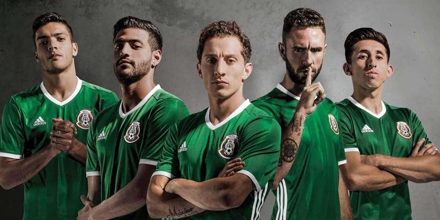 Five male soccer players in green uniforms posing seriously in a studio. — Mexico Soccer Wallpaper