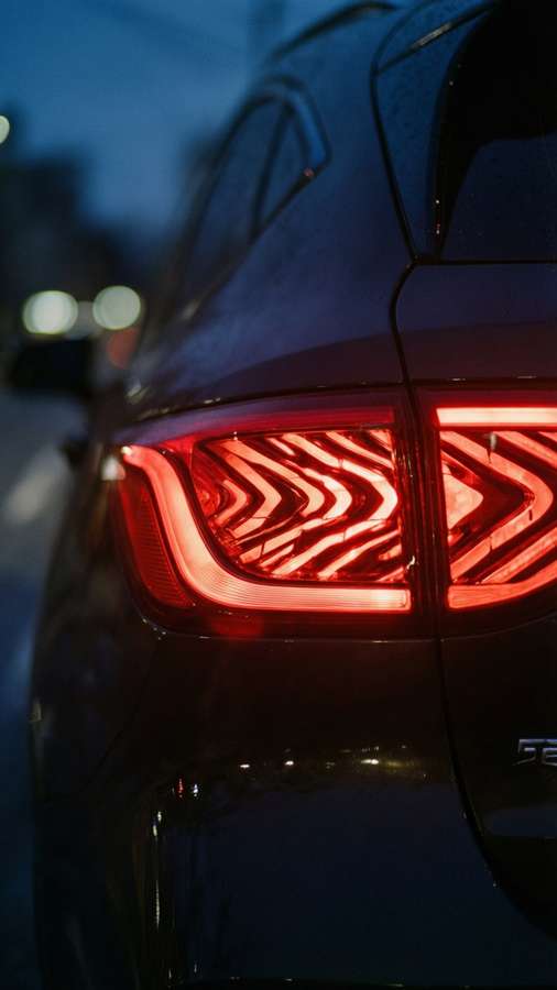 MG5 car rear taillight close-up at night with abstract red glow. — Mg 5 Wallpaper