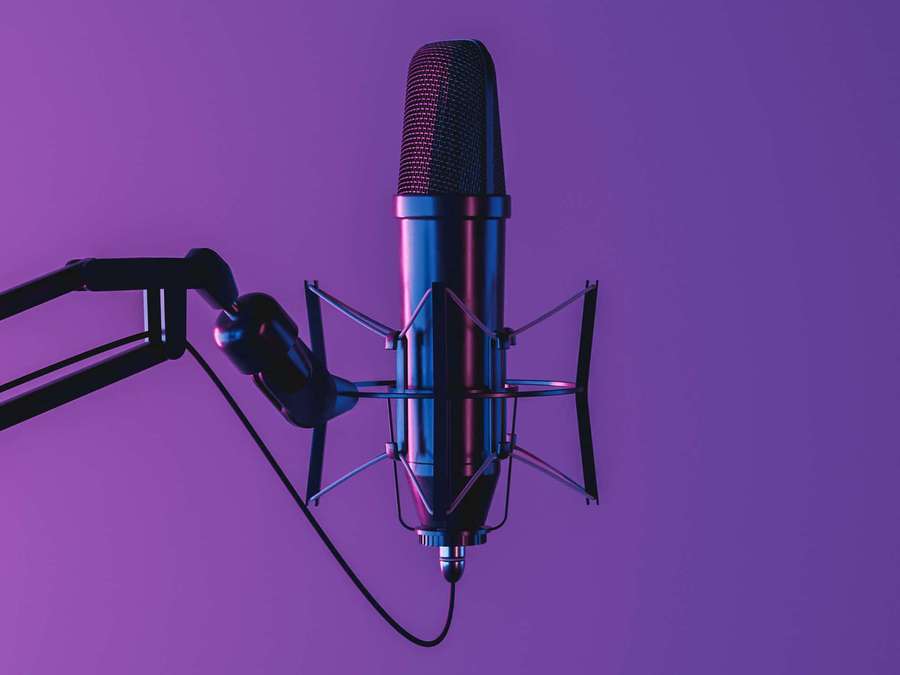 Professional studio microphone on boom arm under purple light — Microphone Picture
