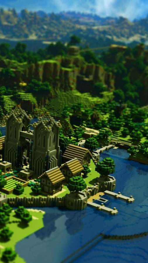 A Minecraft village with stone buildings and wooden roofs beside a blue river in a green valley. — Minecraft Phone Wallpaper