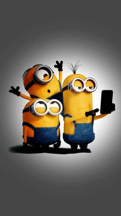 Zwei Minions machen ein Selfie, einer winkt und der andere hält ein Telefon. — Minion Telefon Wallpaper