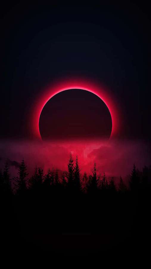 Blood red solar eclipse over a forest at dusk — Moon iPhone Background