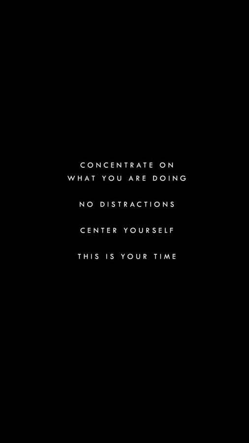 Minimalist black background with white motivational text about concentration and presence. — Motivational Quotes Black Picture