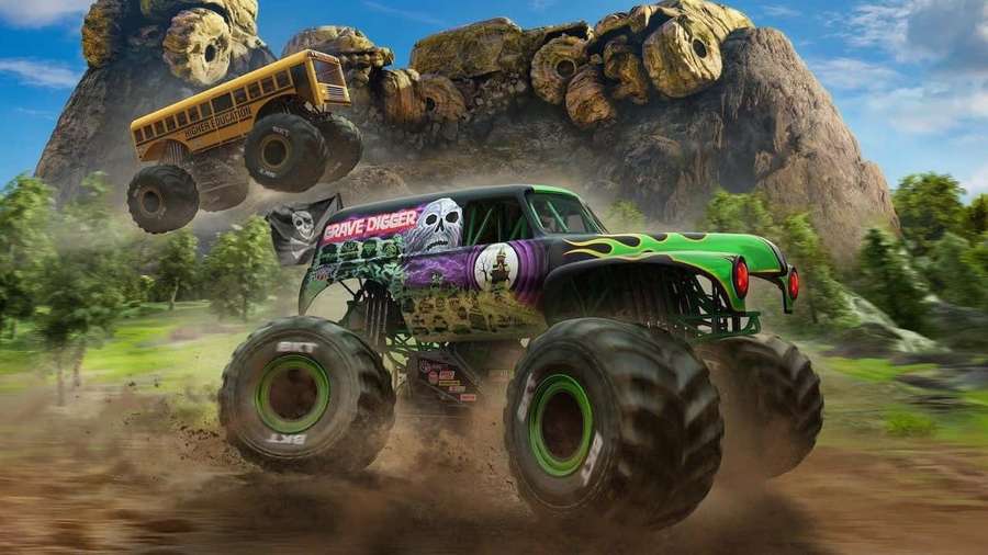 Monster truck and school bus airborne over dirt field near rocky cliff — Motor Picture