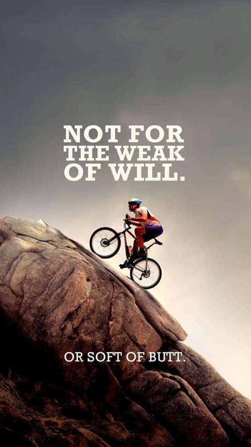 Mountain biker climbing steep rocks with motivational quote. — Mountain Bike iPhone Wallpaper