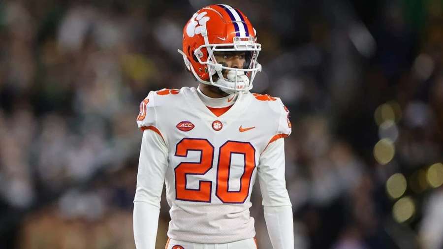 Clemson football player wearing number 20 on the field at night. — Nate Wiggins Wallpaper