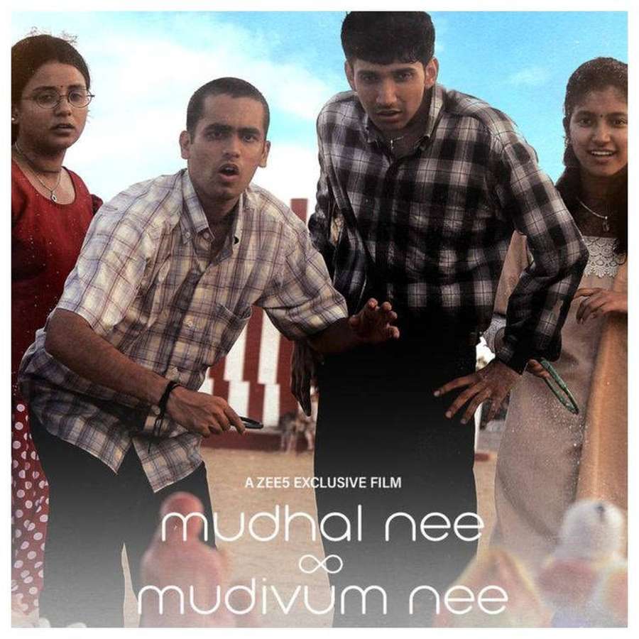 Four young people in plaid shirts and traditional clothing standing together outdoors. — Nee Wallpaper