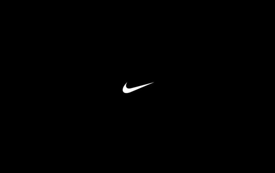 Logotipo blanco del swoosh de Nike sobre fondo negro — Negro puro Fondos de pantalla