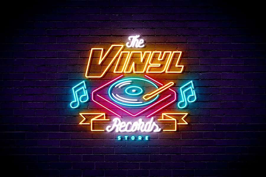 Neon sign for vinyl records store on brick wall with turntable and musical notes. — Neon Text Wallpaper