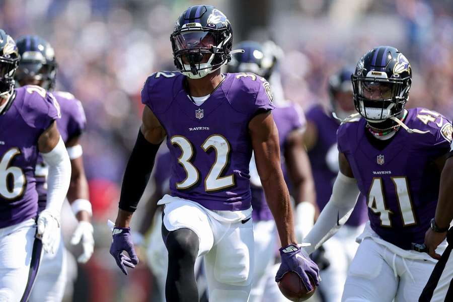 Baltimore Ravens football players running on field during game — NFL Running Backs Wallpaper