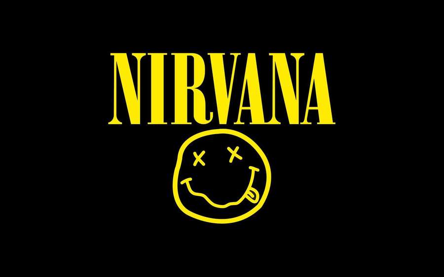 Yellow Nirvana band logo with smiley face on black background. — Nirvana Background