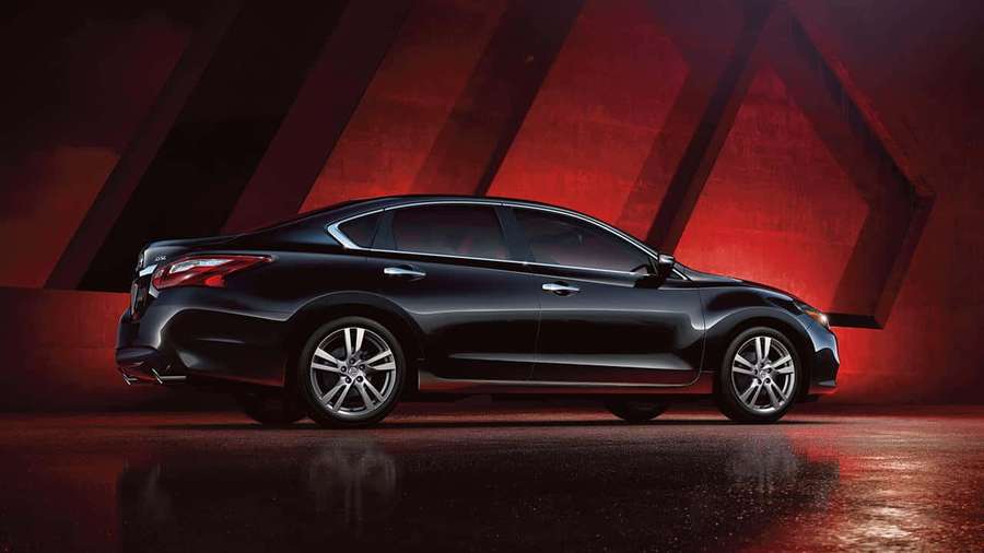 Black sedan in studio with red lighting and reflective floor — Nissan Altima Wallpaper