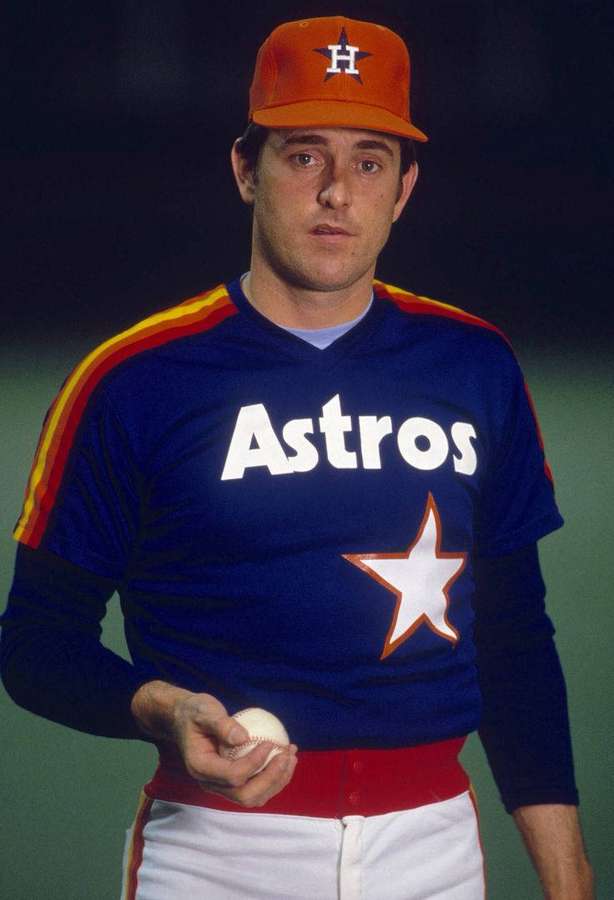 Baseball player in Houston Astros uniform holding a baseball — Nolan Ryan Background
