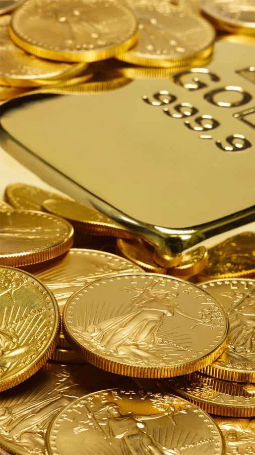 Pila di monete d'oro e un lingotto d'oro con marchio 999.9 — Obbligatorio Sfondi