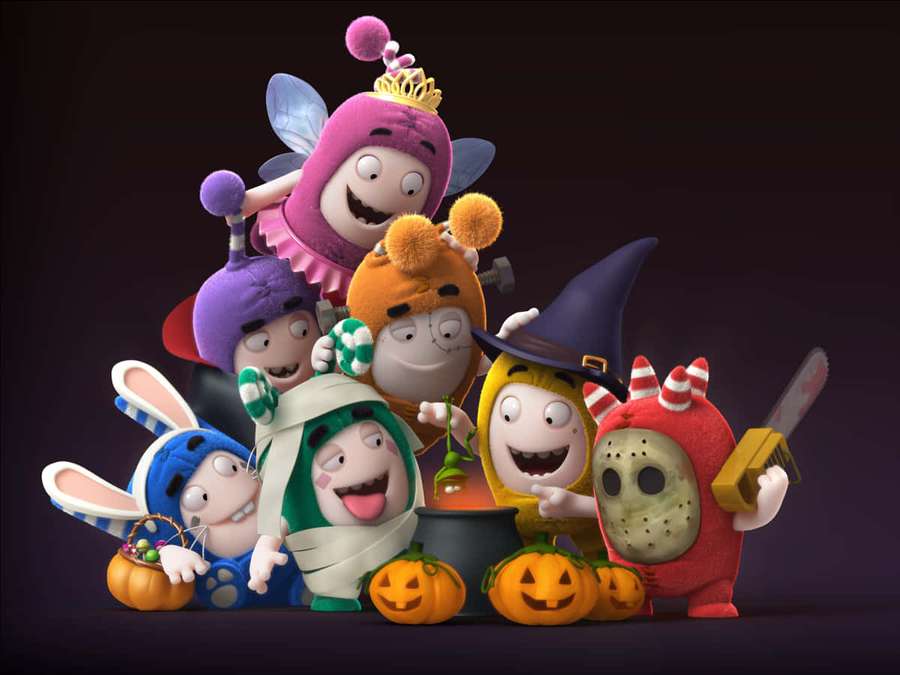 Seven cartoon characters in Halloween costumes around a cauldron with pumpkins. — Oddbods Wallpaper