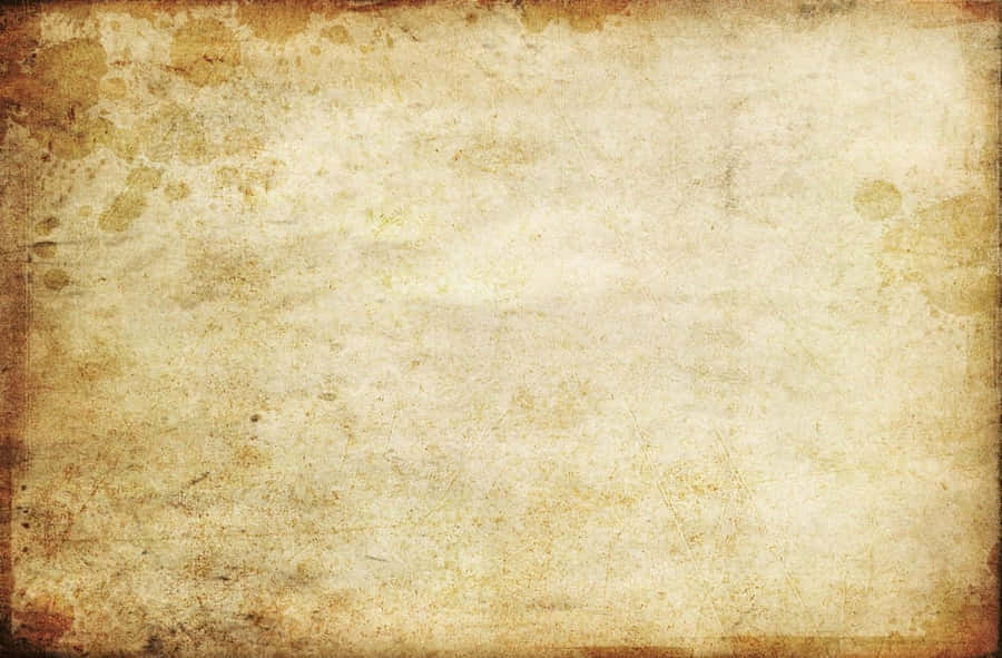 Vintage beige parchment with brown stains and torn edges. — Old Paper Texture Background