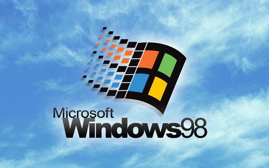 Windows 98 logo against a blue sky with clouds — Old Windows Background