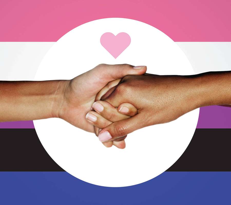 Two hands clasped together over a transgender flag with a pink heart. — Omnisexual Wallpaper