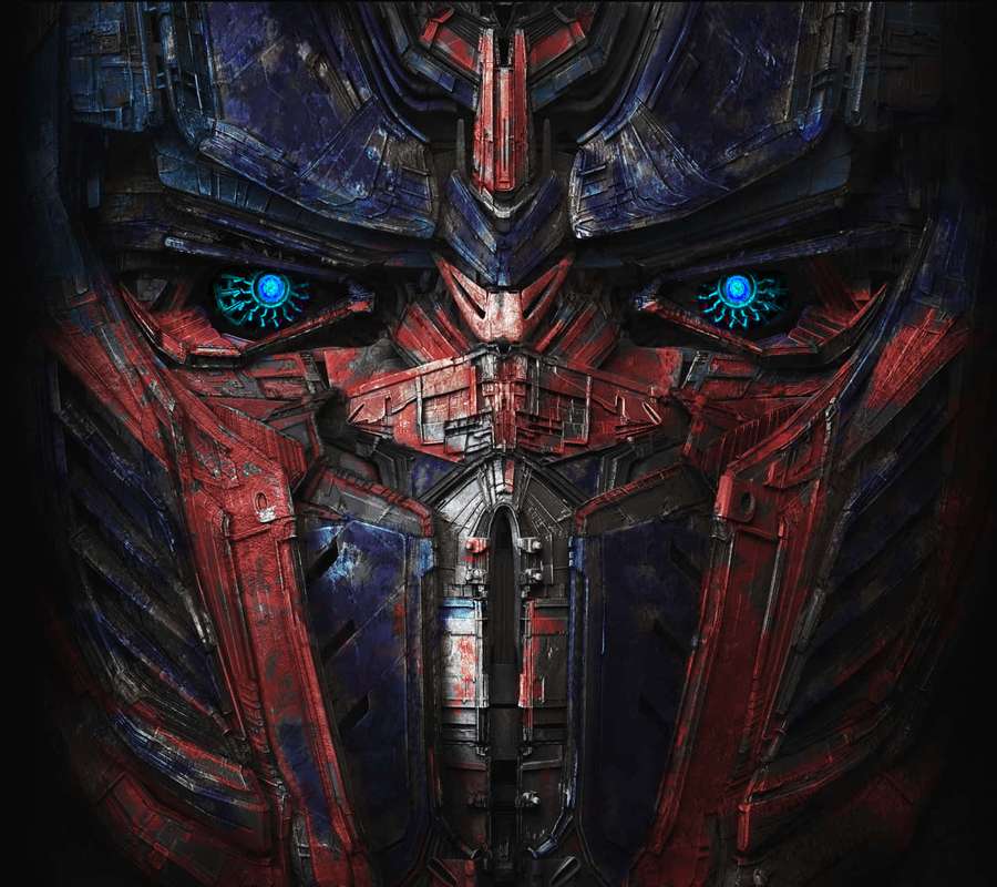 Optimus Prime's face with glowing blue eyes and red blue armor. — Optimus Prime Face Wallpaper