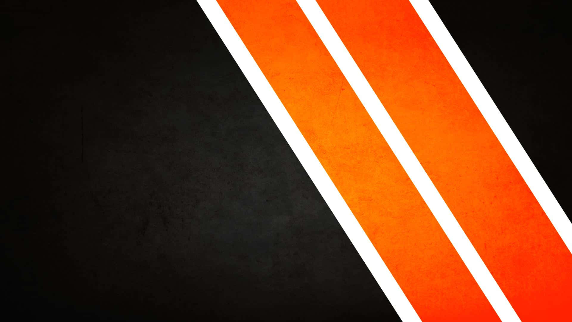 Bold orange and white diagonal stripes on a textured black background. — Orange And Black Background