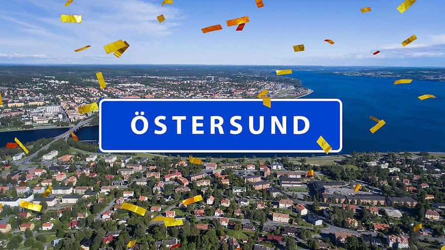 Aerial photo of Östersund city with blue sign and falling golden confetti. — Östersund Wallpaper