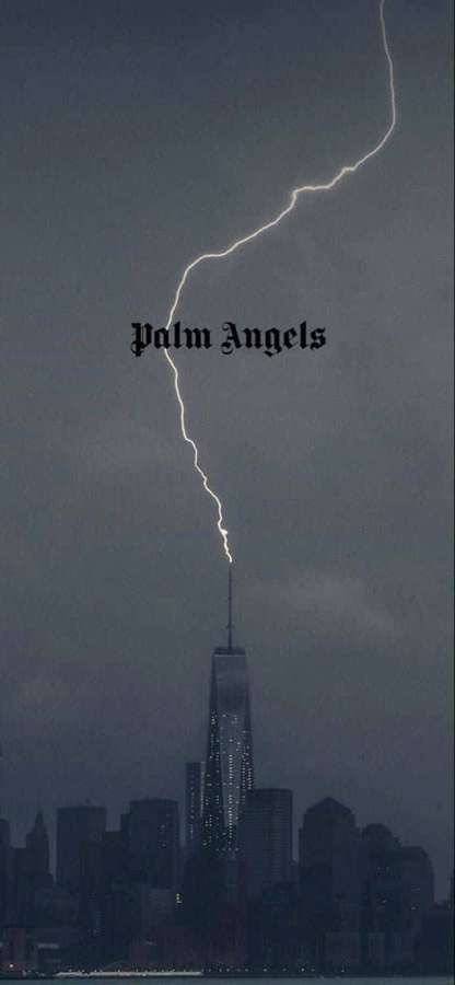 Lightning strikes near One World Trade Center in a dark urban skyline. — Palm Angels Wallpaper