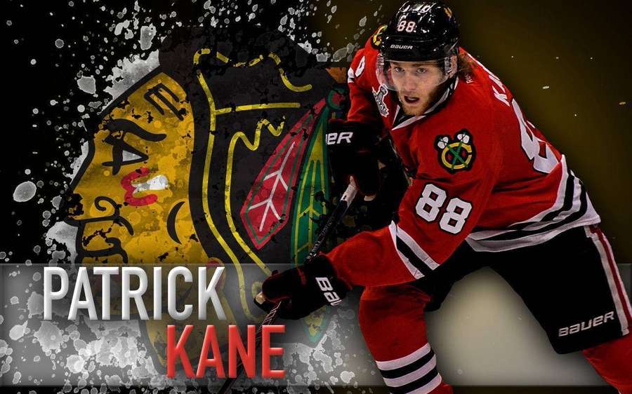 Patrick Kane in Blackhawks uniform mid-swing with team logo backdrop. — Patrick Kane Background