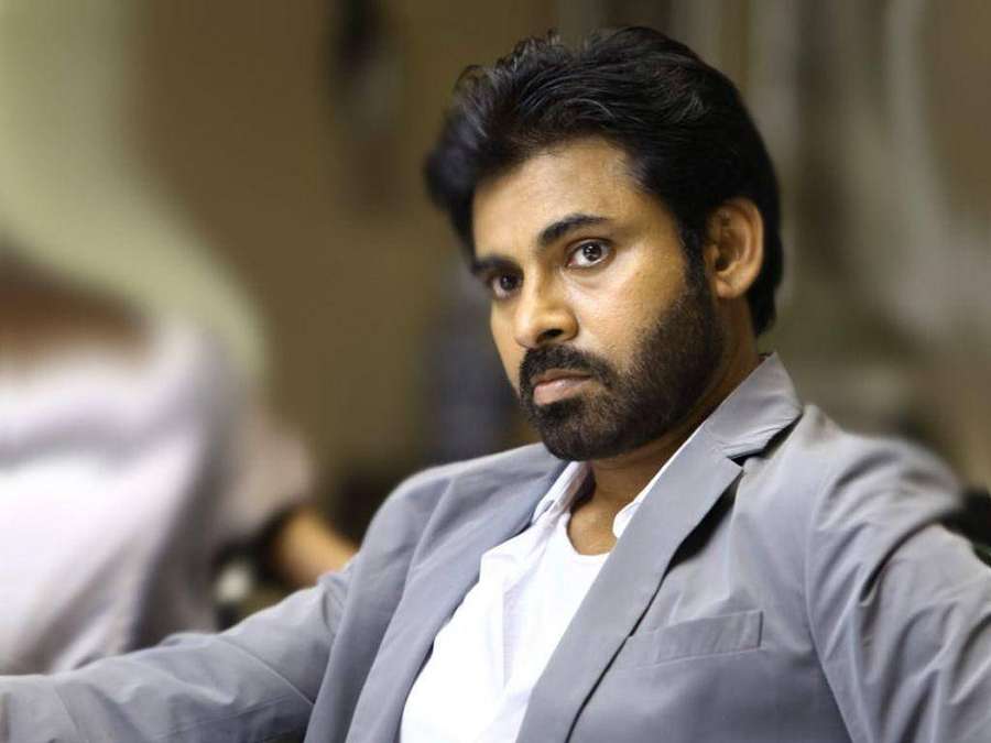 Man in gray blazer and white shirt looking directly at camera indoors — Pawan Kalyan Wallpaper