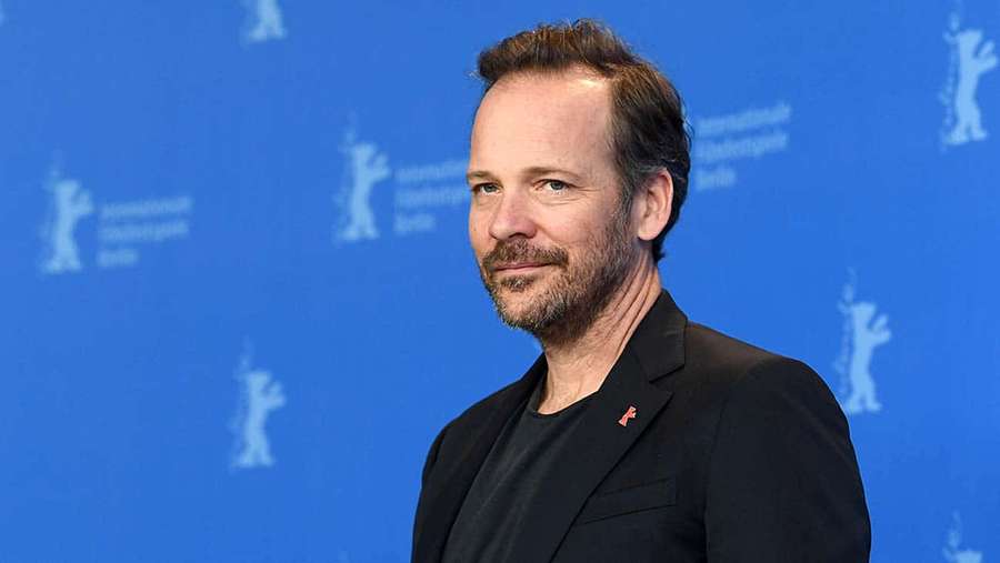 Man in black suit at Berlin film festival press event — Peter Sarsgaard Picture