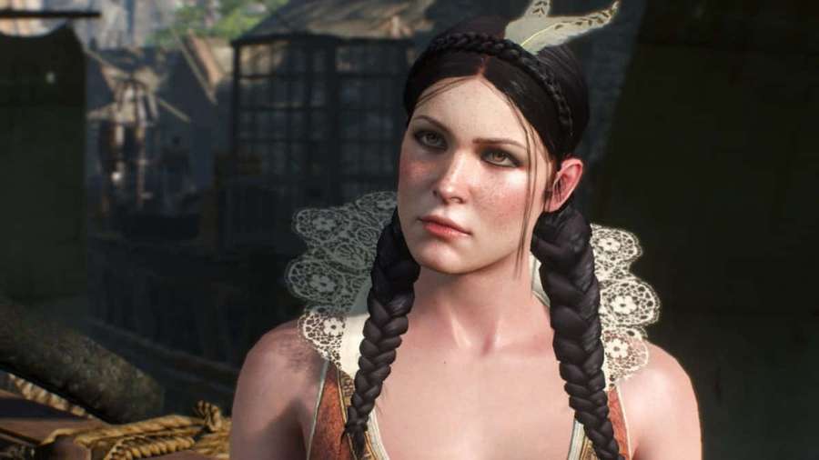 A woman with dark braids and freckles in medieval attire outdoors. — Philippa Eilhart Wallpaper