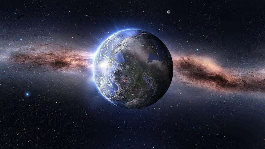 Planet Earth viewed from space with a glowing nebula and stars in the background. — Pluto Picture
