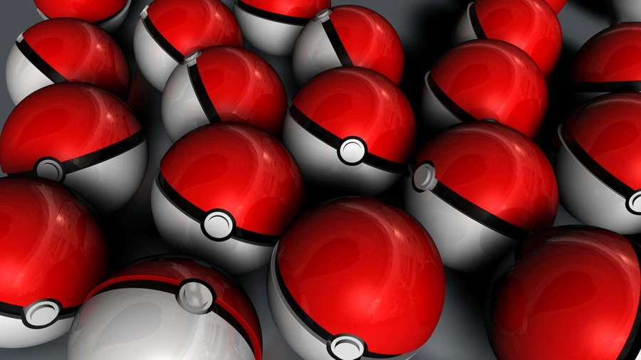 Cluster of red and white Poké Balls with black bands and silver buttons. — Pokeball Background
