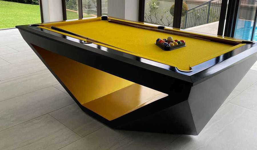 Modern geometric pool table with yellow felt and black frame in a luxury indoor setting. — Pool Table Picture