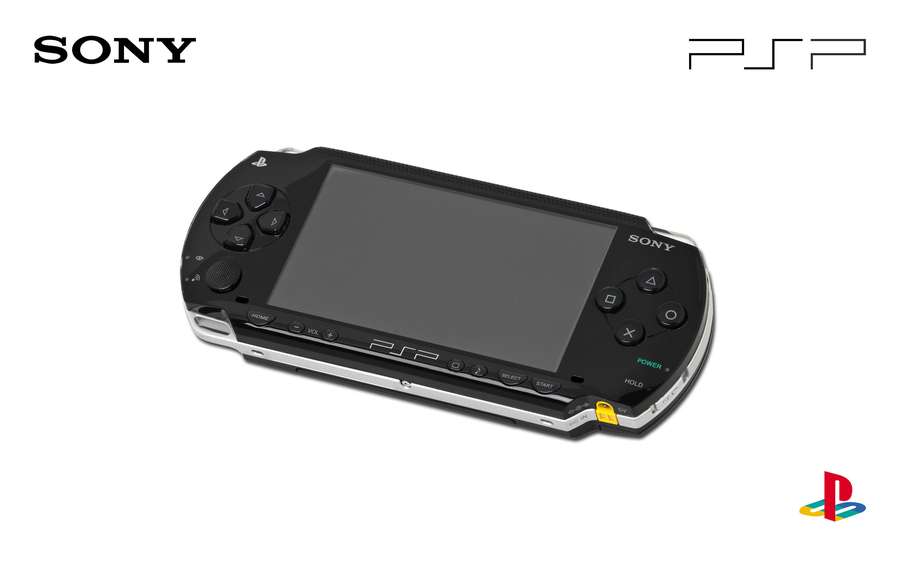 Black Sony PSP handheld gaming device with silver accents and logo branding. — Psp Wallpaper