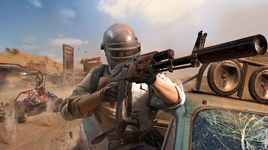 Soldier aiming rifle from broken car in desert battle scene — Pubg Picture