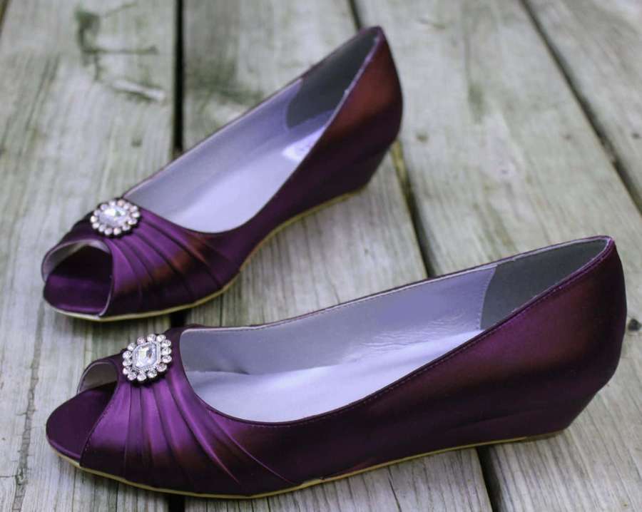 Purple satin peep-toe wedge heels with crystal brooches on wooden surface — Purple Shoes Wallpaper