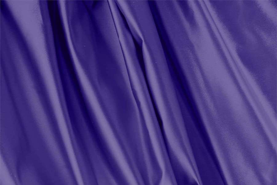 Close-up of flowing purple satin fabric with soft highlights. — Purple Silk Wallpaper