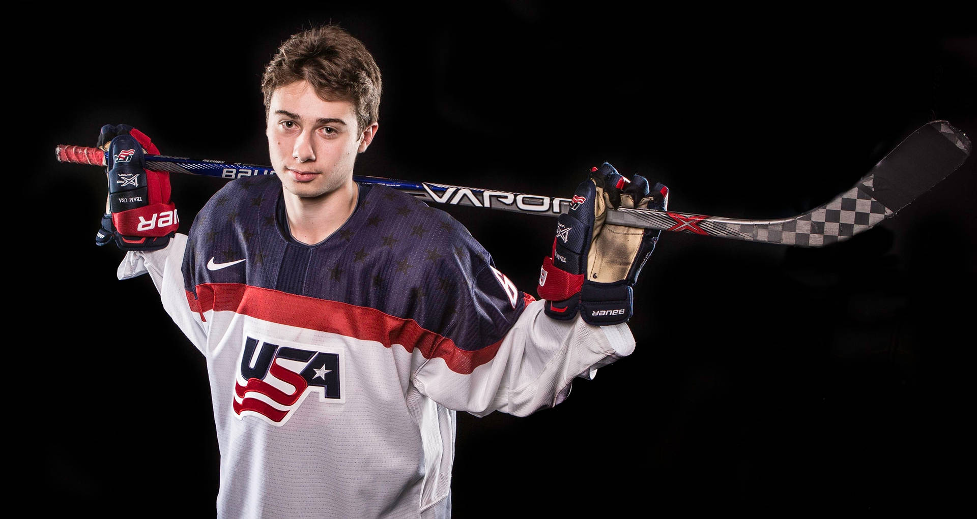 Download Quinn Hughes Looking In Front With White Background Wallpaper