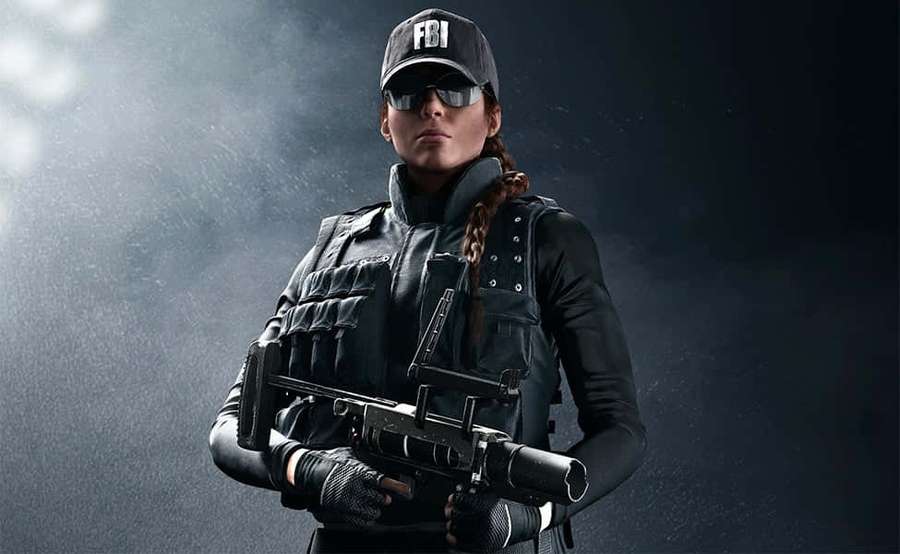 FBI agent in tactical gear holding a rifle under spotlight in smoky dark setting. — Rainbow Six Siege Ash Wallpaper