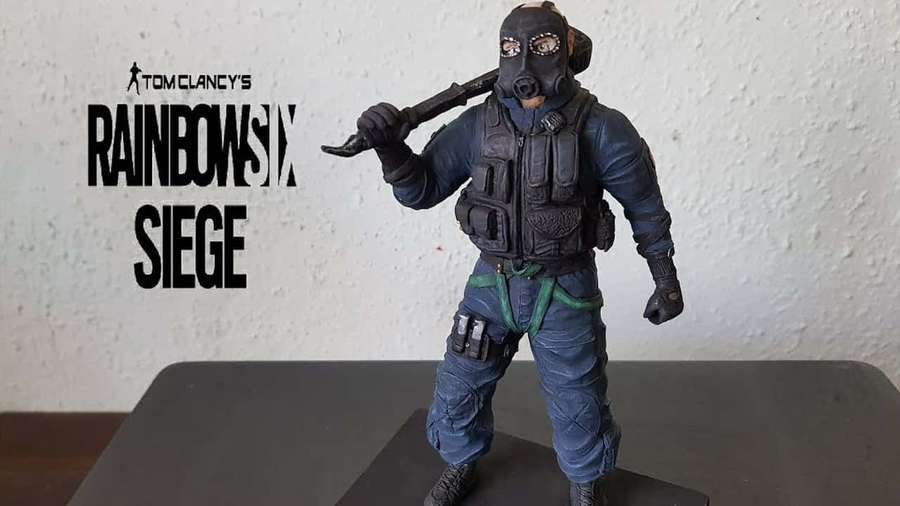 Rainbow Six Siege operator action figure holding a baton on display. — Rainbow Six Siege Sledge Wallpaper