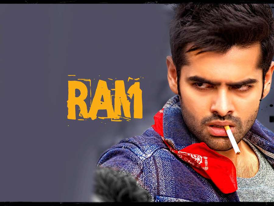 Hombre con mirada intensa fumando cigarrillo usando bandana roja y chaqueta vaquera. — Ram Pothineni Fondos de pantalla