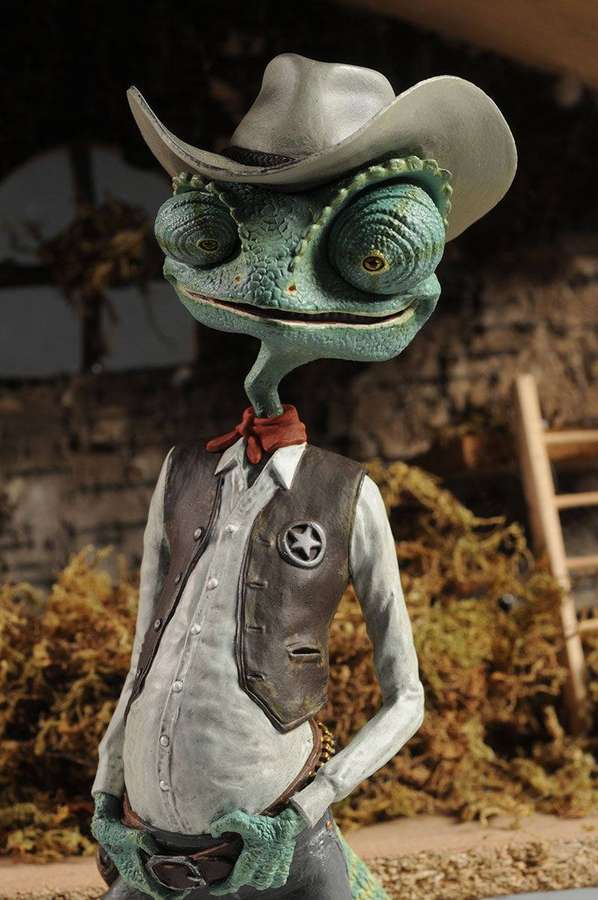 Ein grünes Chamäleon als Cowboy in einer Scheune. — Rang Wallpaper