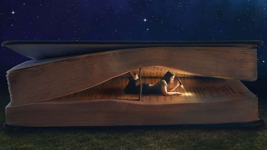 Person reading inside a giant open book under a starry sky. — Reading Background