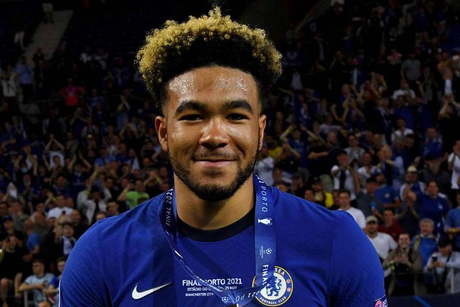 Football player wearing trophy medal at stadium celebration — Reece James Wallpaper