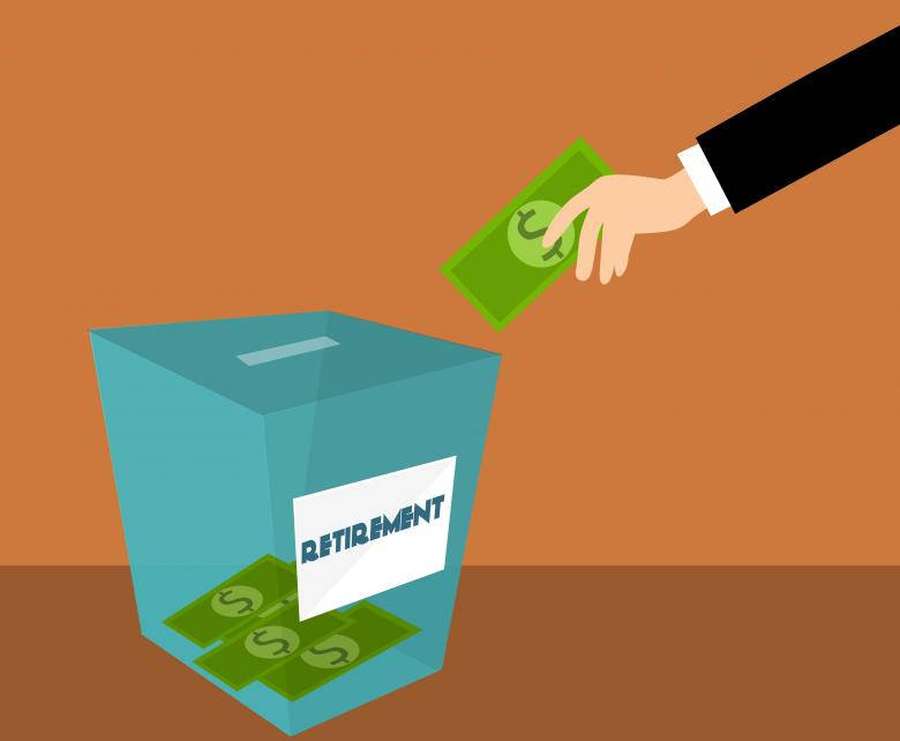 Hand depositing money into a retirement savings box. — Retirement Wallpaper