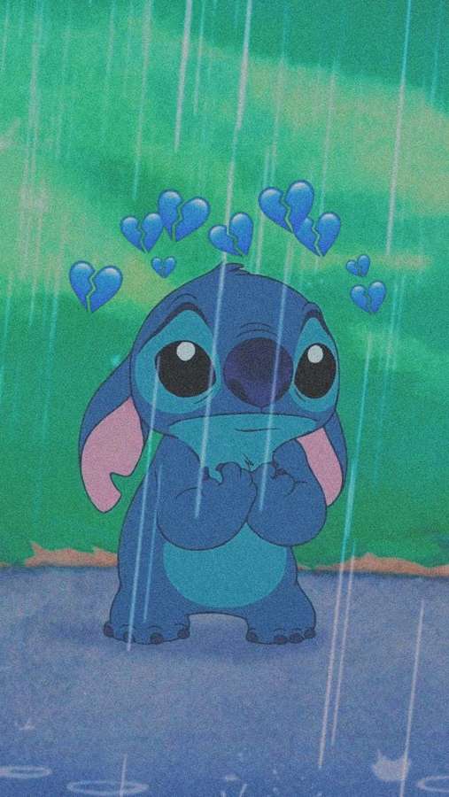 Sad blue alien Stitch in rain with broken hearts floating above him. — Sad Stitch Wallpaper