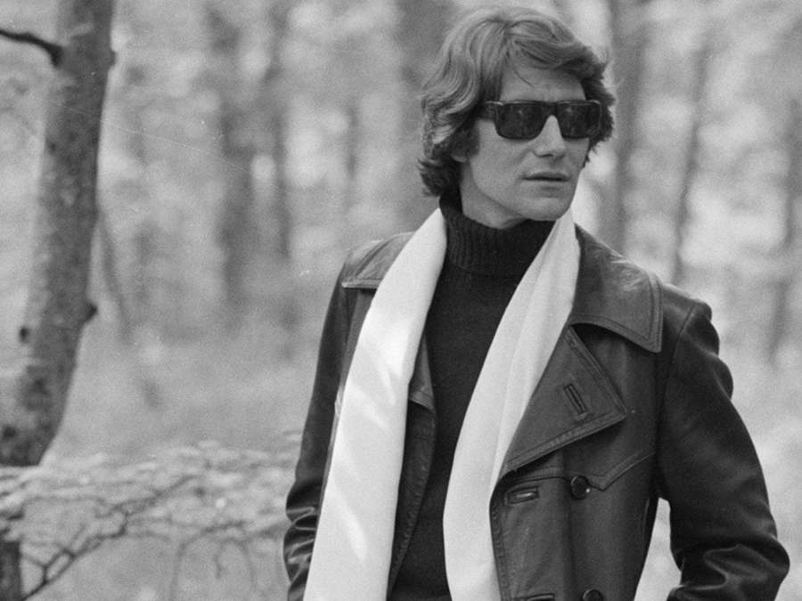 Man wearing sunglasses leather jacket and white scarf in forest — Saint laurent Wallpaper