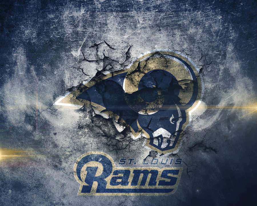 St. Louis Rams logo breaking through cracked concrete wall with light beams. — Saint Louis Rams Wallpaper